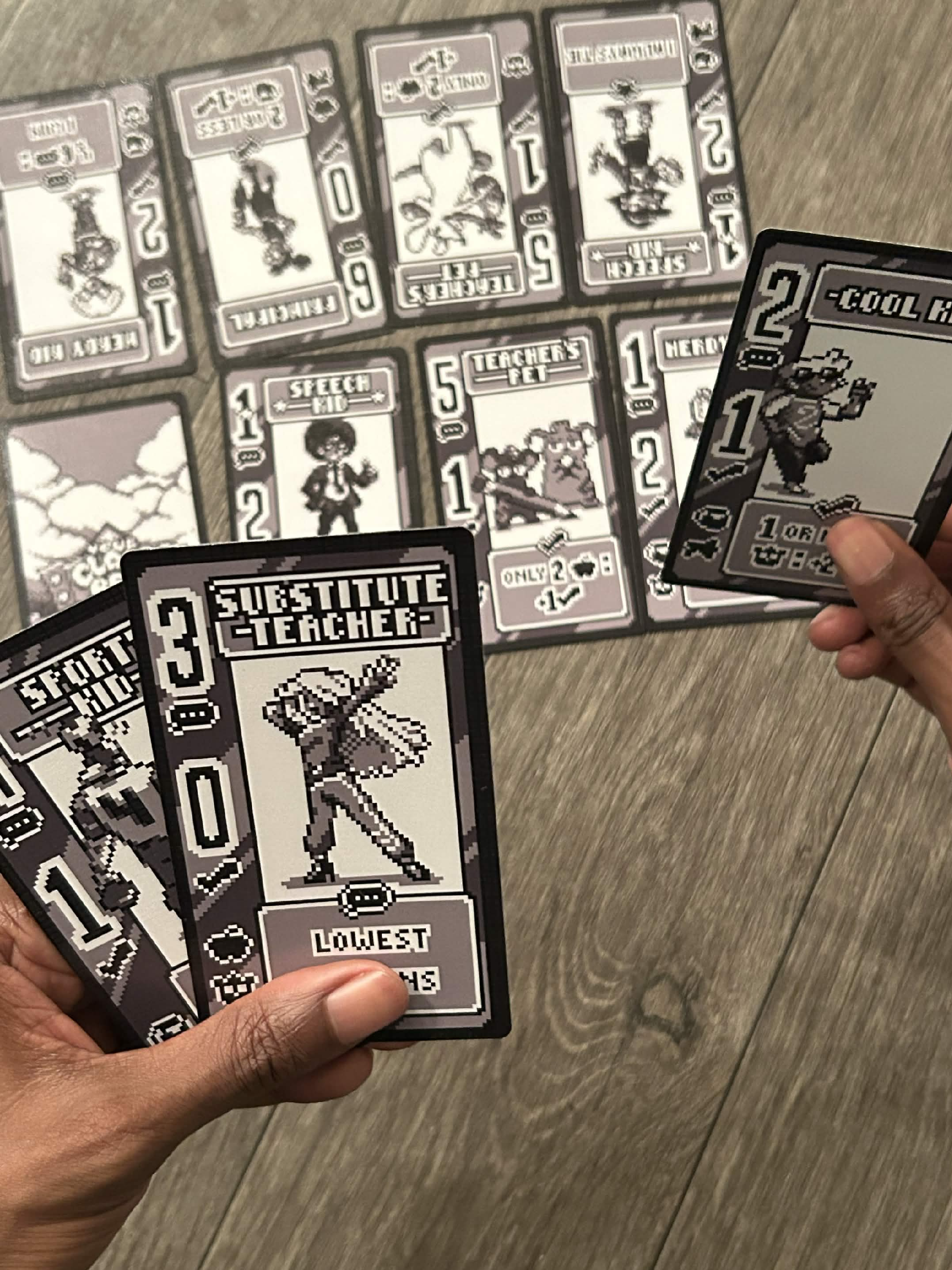 Players holding Your Class Rep cards as they compare their campaign picks.